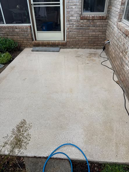 Clean concrete patio after pressure washing